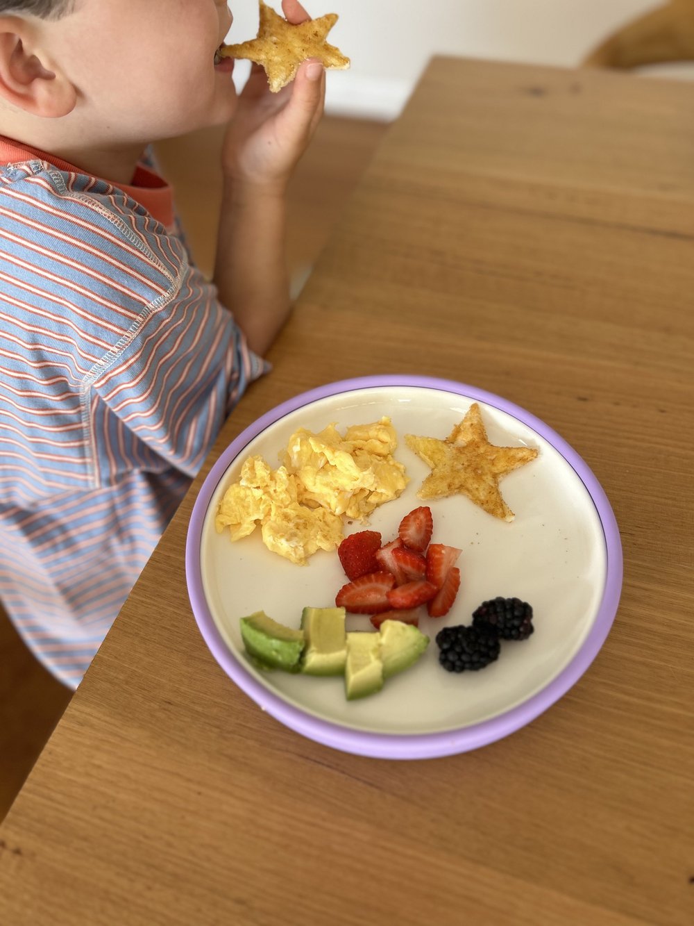 Breakfast served in a purple Plate Mate